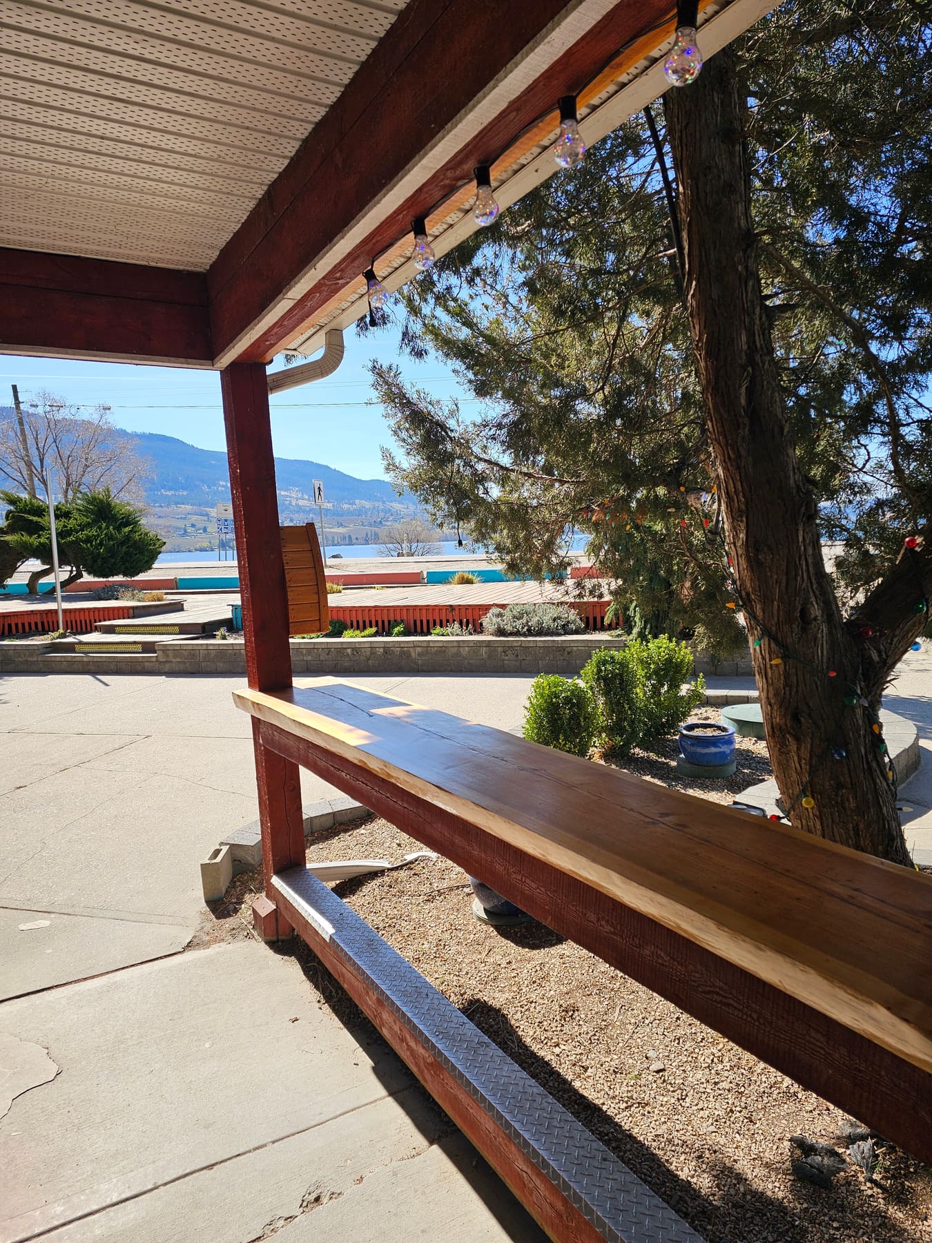 The bench under the deck at Lu Lou's, a rest stop on the Okanagan Rail Trail in Oyama, BC