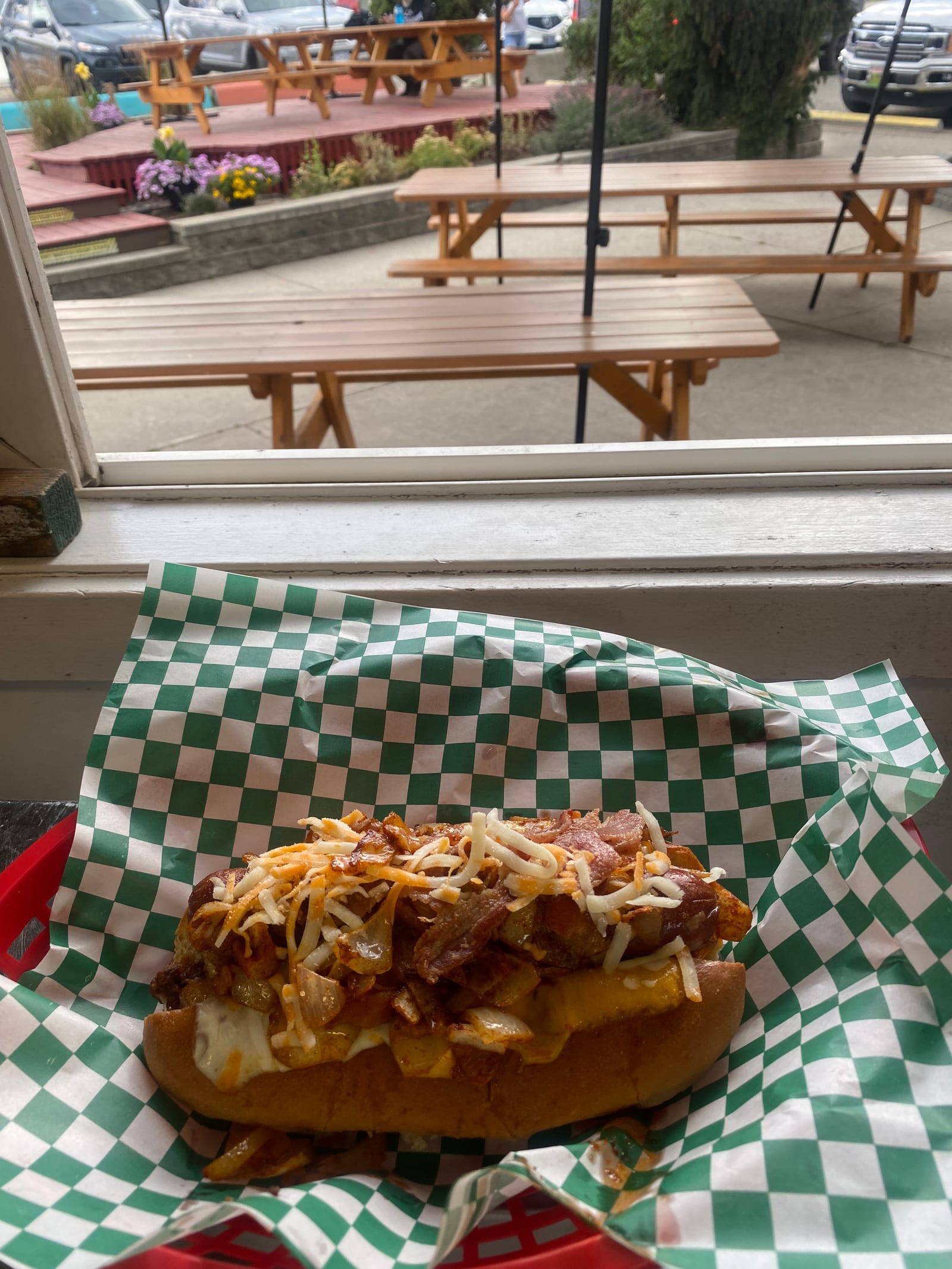 A Baked Boat Dog with curly fries, loaded all-beef hot dog at Lu Lou's Lakeside Grill, Oyama BC